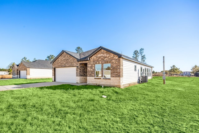 ranch-style house with central AC, a garage, and a front yard