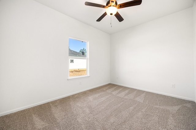 empty room with ceiling fan and carpet