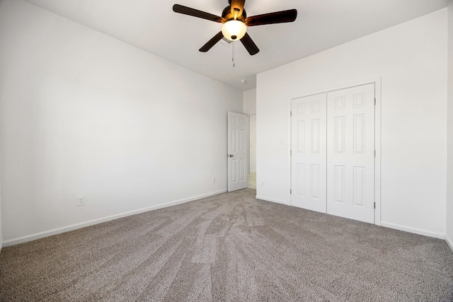 unfurnished bedroom featuring a closet, ceiling fan, and carpet flooring