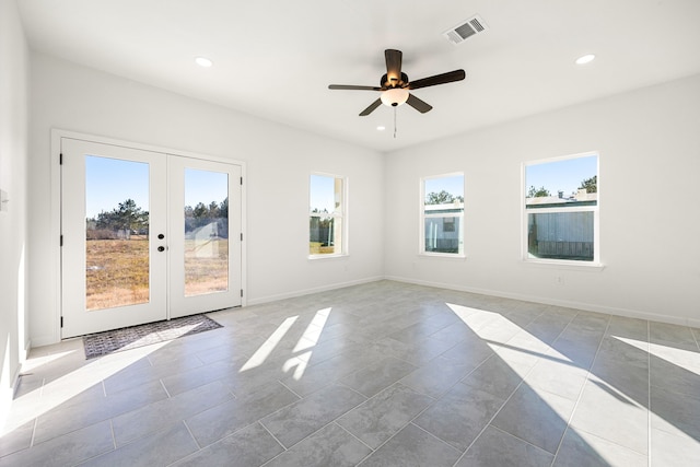 unfurnished room with french doors, ceiling fan, and light tile patterned flooring