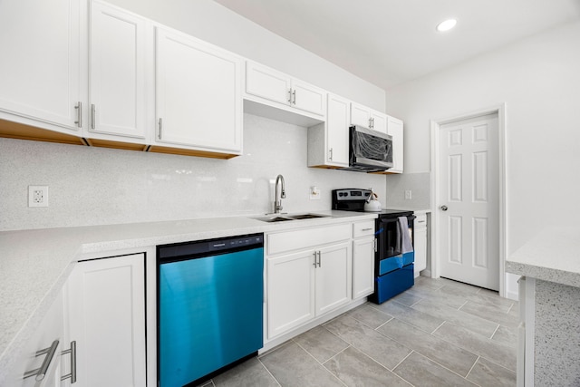 kitchen featuring tasteful backsplash, white cabinetry, sink, dishwashing machine, and black electric range