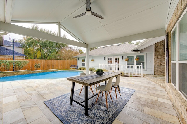 view of patio featuring a fenced in pool, french doors, and ceiling fan