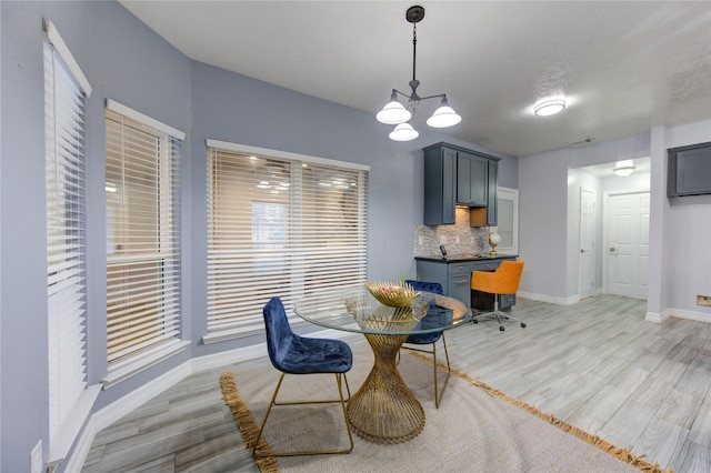 dining space featuring light hardwood / wood-style floors