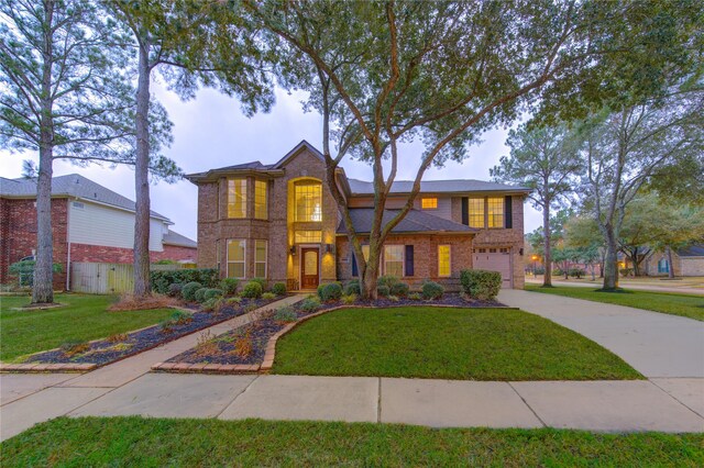 view of front of property with a garage and a front yard