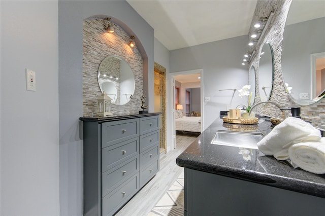 bathroom featuring vanity and hardwood / wood-style floors