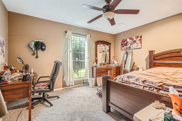 bedroom with light carpet, a textured ceiling, and ceiling fan