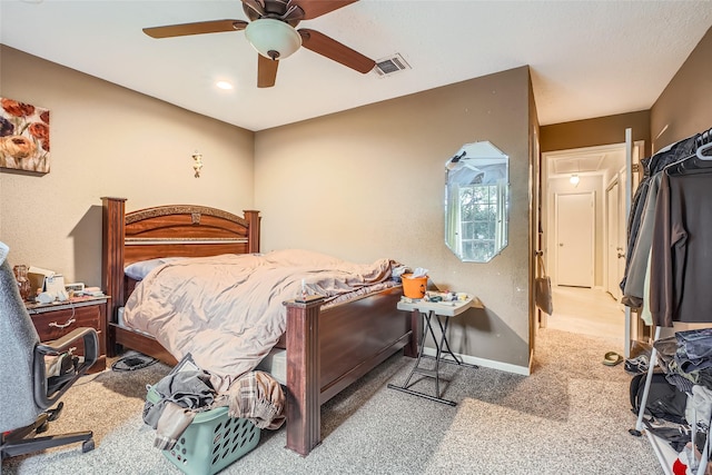 bedroom featuring ceiling fan and carpet