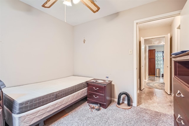 bedroom featuring ceiling fan and light carpet