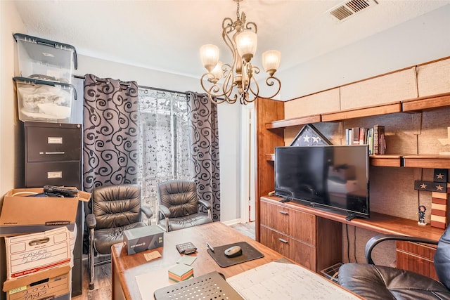 living room featuring an inviting chandelier and light hardwood / wood-style flooring