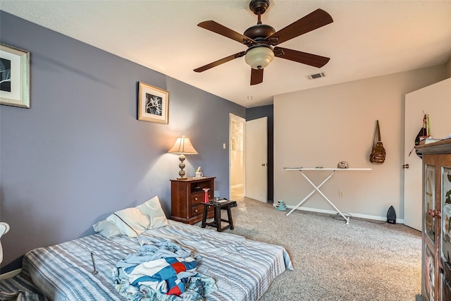 bedroom with ceiling fan and carpet floors