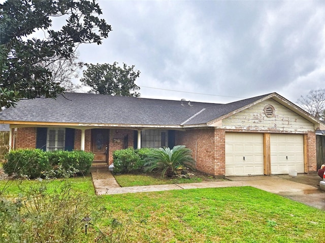 single story home featuring a garage and a front lawn