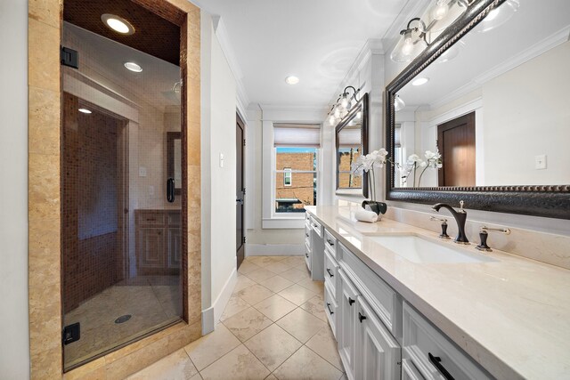 bathroom with vanity, tile patterned floors, a shower with shower door, and ornamental molding