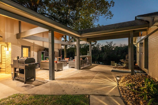 view of patio with grilling area, an outdoor hangout area, and an outdoor bar