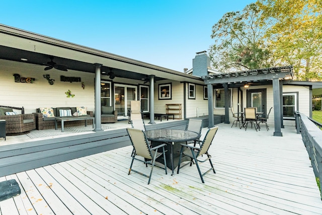 wooden deck featuring ceiling fan, outdoor lounge area, and a pergola