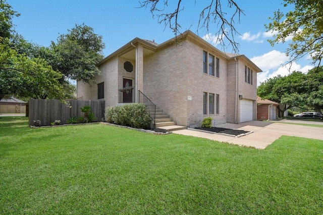 view of front of home featuring a garage and a front lawn