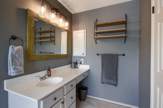 bathroom featuring vanity and a textured ceiling