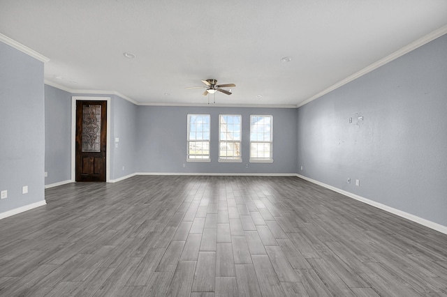 unfurnished room with hardwood / wood-style flooring, ceiling fan, and ornamental molding