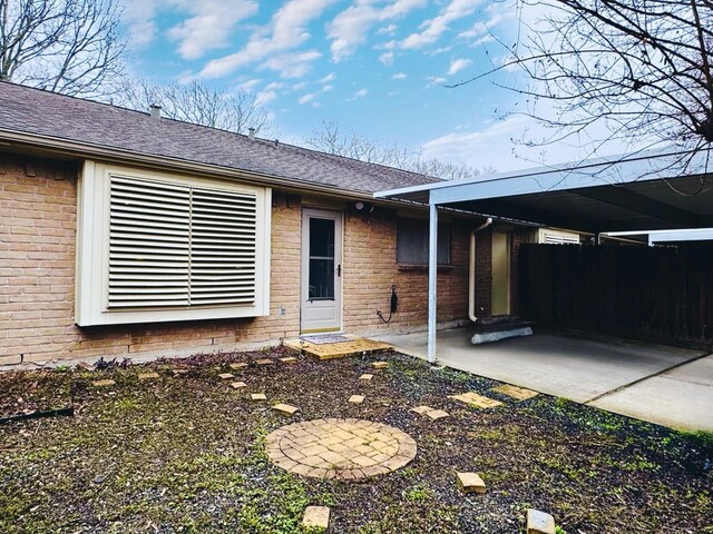 entrance to property featuring a patio area