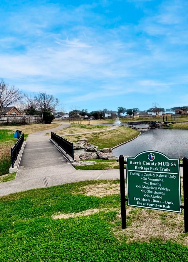 surrounding community with a water view