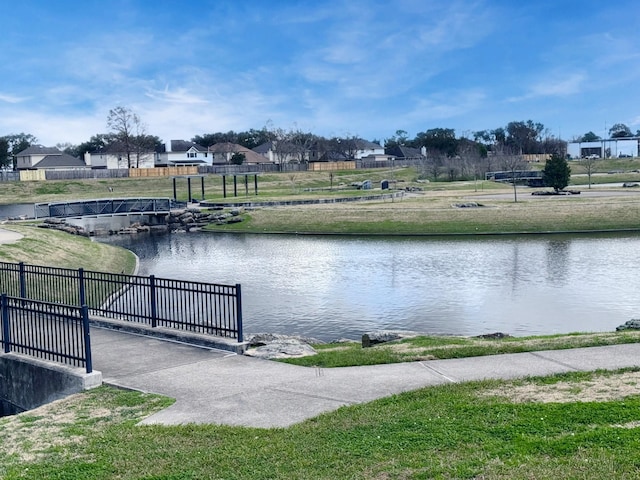 view of water feature with fence