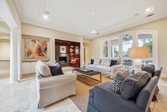 living room with french doors and ornate columns