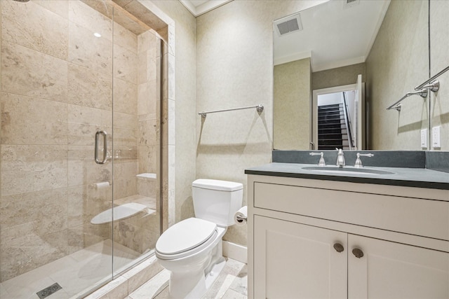 bathroom featuring vanity, crown molding, toilet, and walk in shower