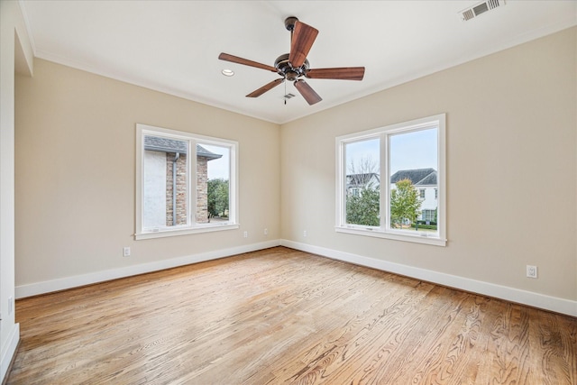 empty room featuring ceiling fan and light wood-type flooring