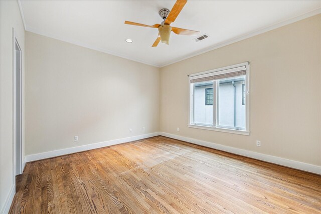 unfurnished room with crown molding, light hardwood / wood-style flooring, and ceiling fan