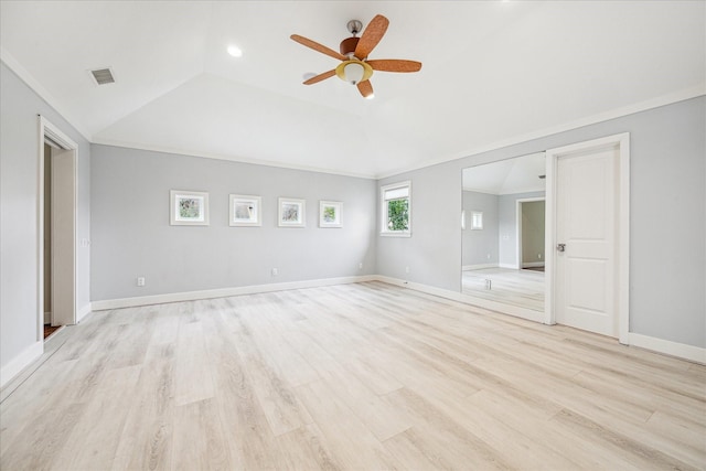 unfurnished bedroom with ornamental molding, vaulted ceiling, ceiling fan, and light wood-type flooring