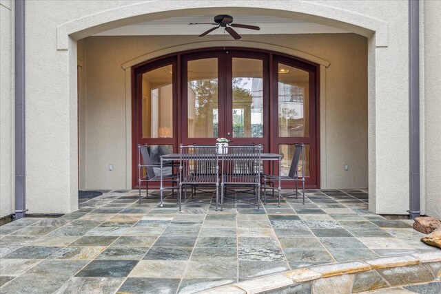 property entrance with a patio and ceiling fan