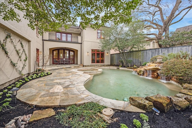 view of pool featuring a patio and an in ground hot tub