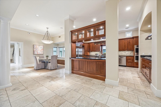 kitchen featuring decorative light fixtures, ornamental molding, appliances with stainless steel finishes, decorative columns, and backsplash