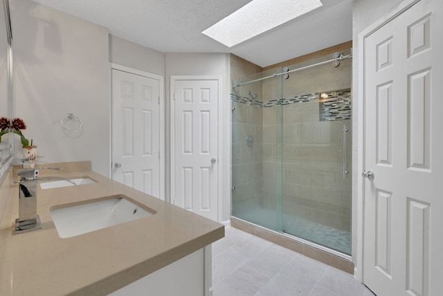 1912 Trixie Ln, Houston, TX 77042 - full bath with a skylight, a shower stall, and double vanity