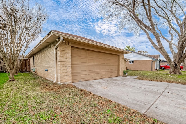 garage featuring a lawn