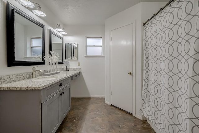 bathroom featuring vanity and concrete floors