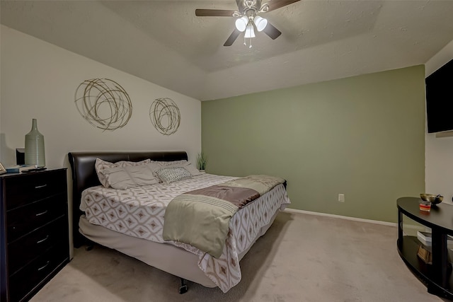 carpeted bedroom featuring vaulted ceiling and ceiling fan