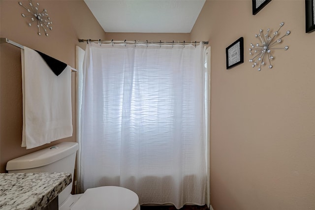 bathroom featuring toilet and shower / bath combination