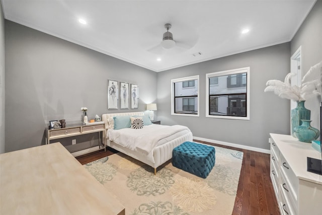 bedroom featuring crown molding, ceiling fan, and dark hardwood / wood-style flooring