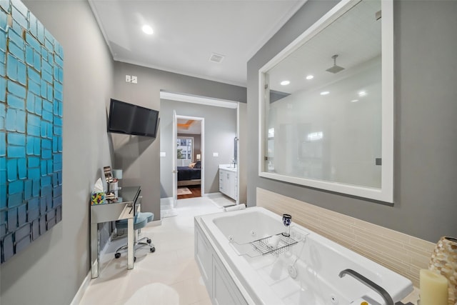 bathroom with tile patterned flooring, vanity, and a bathtub