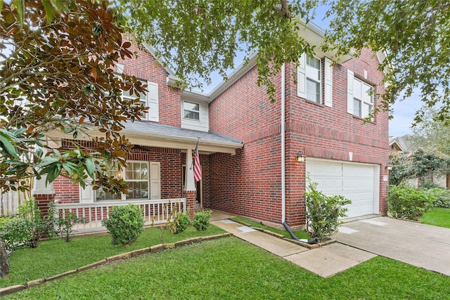 multi unit property with a garage, a porch, and a front yard