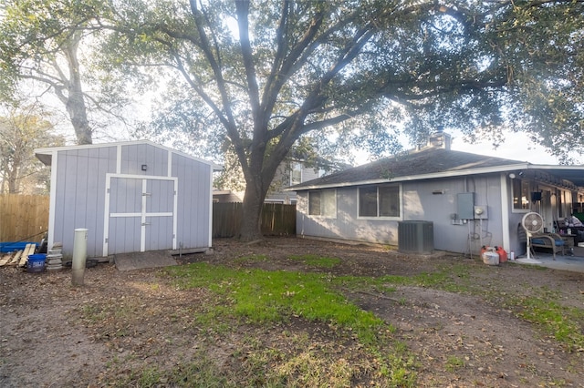 exterior space featuring a storage shed and central air condition unit