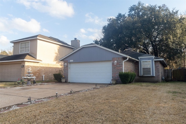 ranch-style home with a garage and a front lawn