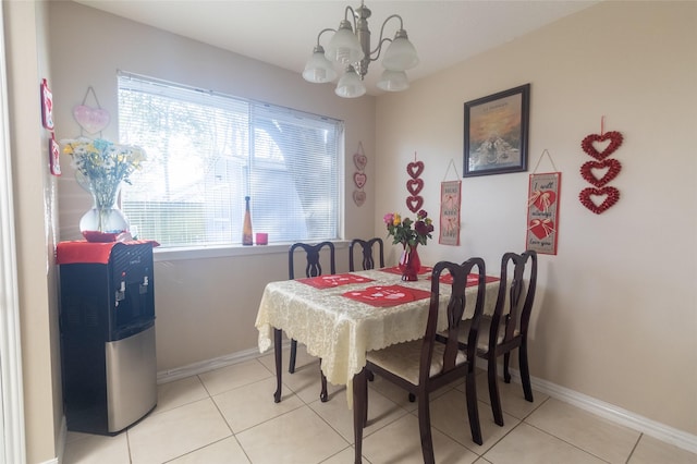 tiled dining room featuring a notable chandelier and a wealth of natural light