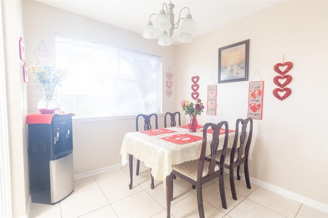 dining room with an inviting chandelier and light tile patterned floors