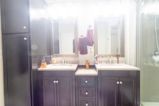 bathroom with walk in shower and vanity