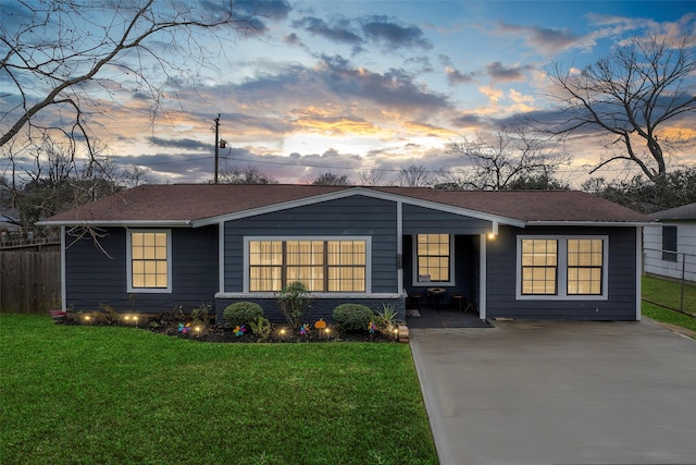 single story home featuring a yard