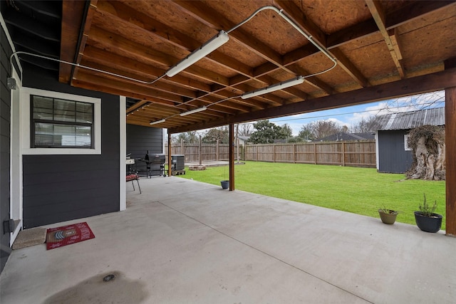 view of patio with a storage shed