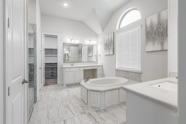 bathroom with lofted ceiling, vanity, and plus walk in shower