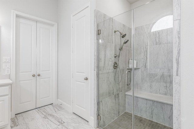 bathroom featuring vanity and an enclosed shower