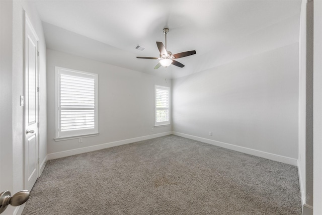 unfurnished room with ceiling fan and carpet flooring